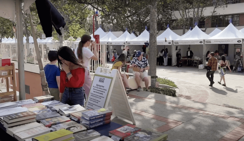 books for sale and other booths at the Los Angeles Festival of Books