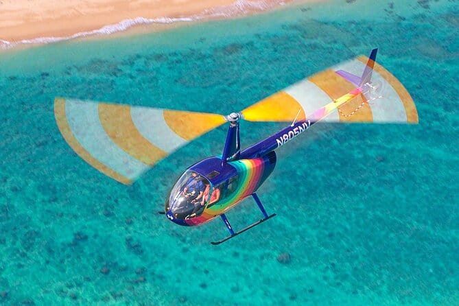 Things to do in Oahu for Couples: Experience a romantic helicopter ride over a stunning beach and ocean.