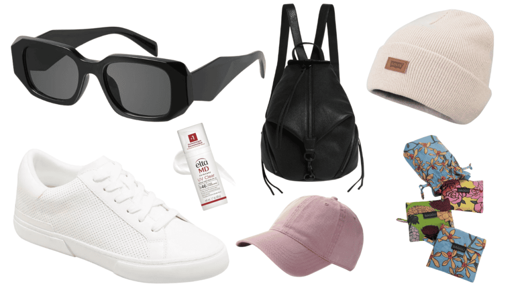 A collection of items perfect for what to wear in Los Angeles, including black sunglasses, white sneakers, sunscreen, a black backpack, a beige beanie, a pink baseball cap, and colorful mittens.